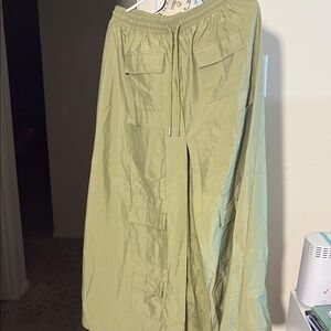 Olive Green Cargo Skirt with Long Spilt in front of Skirt with pockets.